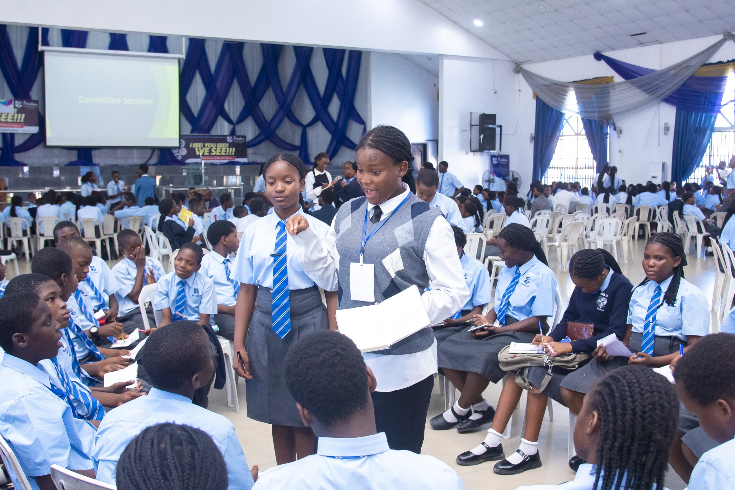 Student speaking to other students